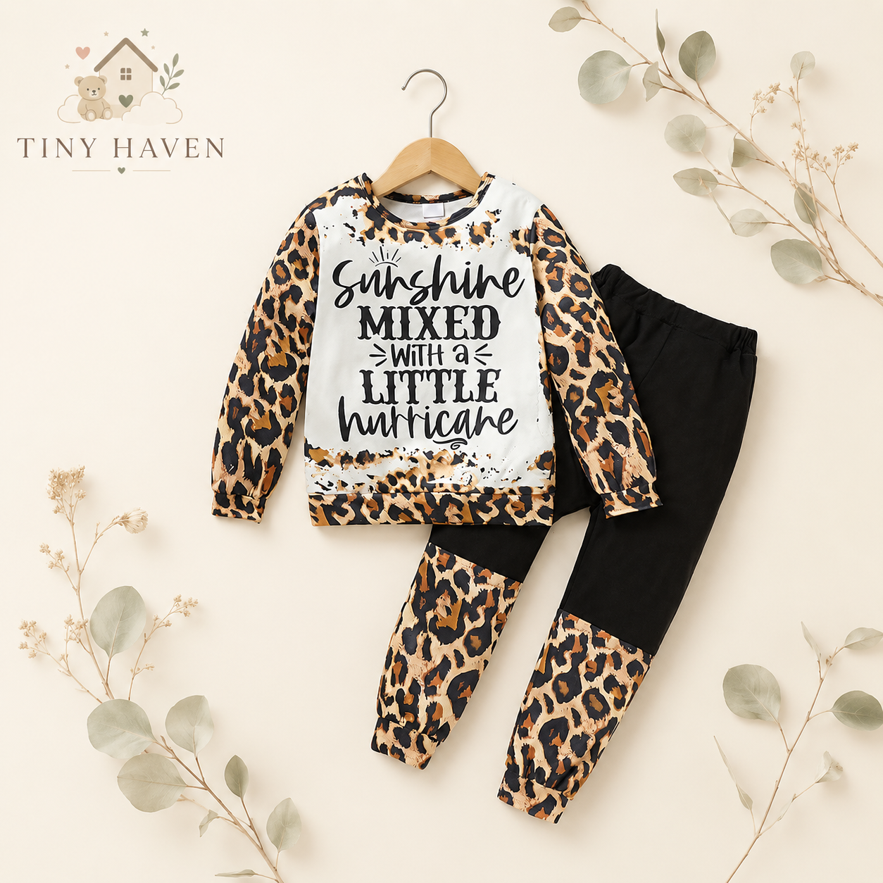 Toddler leopard print sweatsuit with matching pants on a neutral Tiny Haven branded background.